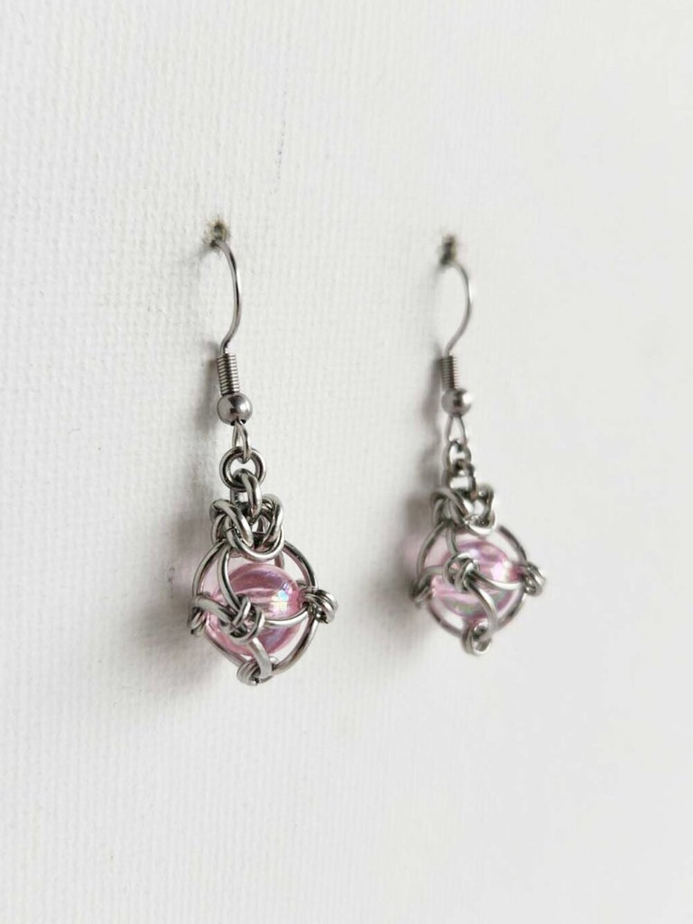 Silver and pink fairy dangly earrings